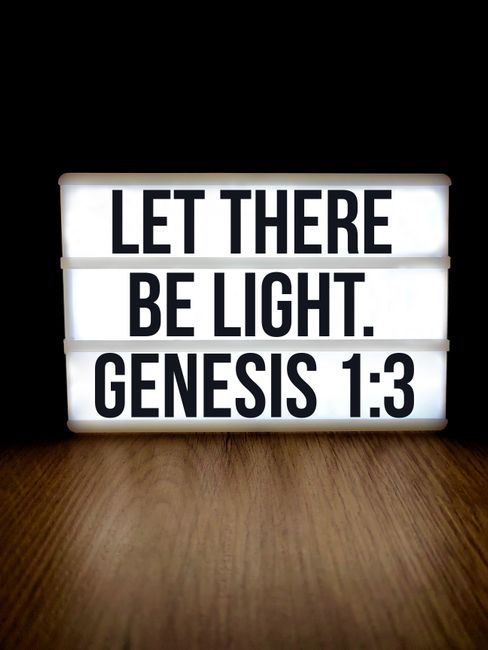 Bible open to Genesis chapter 4 for verse-by-verse commentary and study