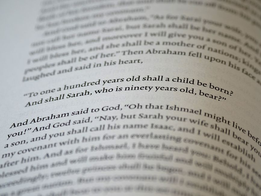 Bible open to Genesis chapter 45 for verse-by-verse commentary and study
