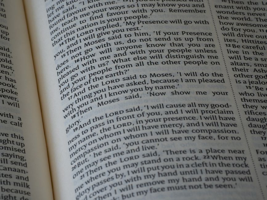 Bible open to Exodus chapter 4 for verse-by-verse commentary and study