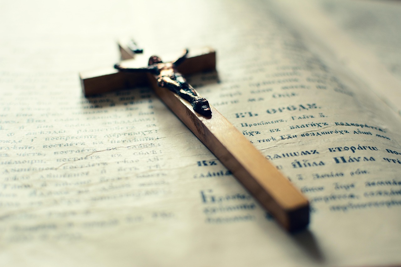 Bible open to Acts chapter 19 for verse-by-verse commentary and study