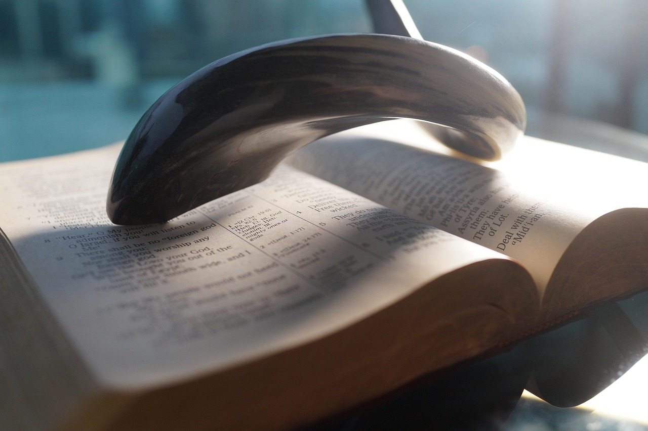 Bible open to Jeremiah chapter 1 for verse-by-verse commentary and study