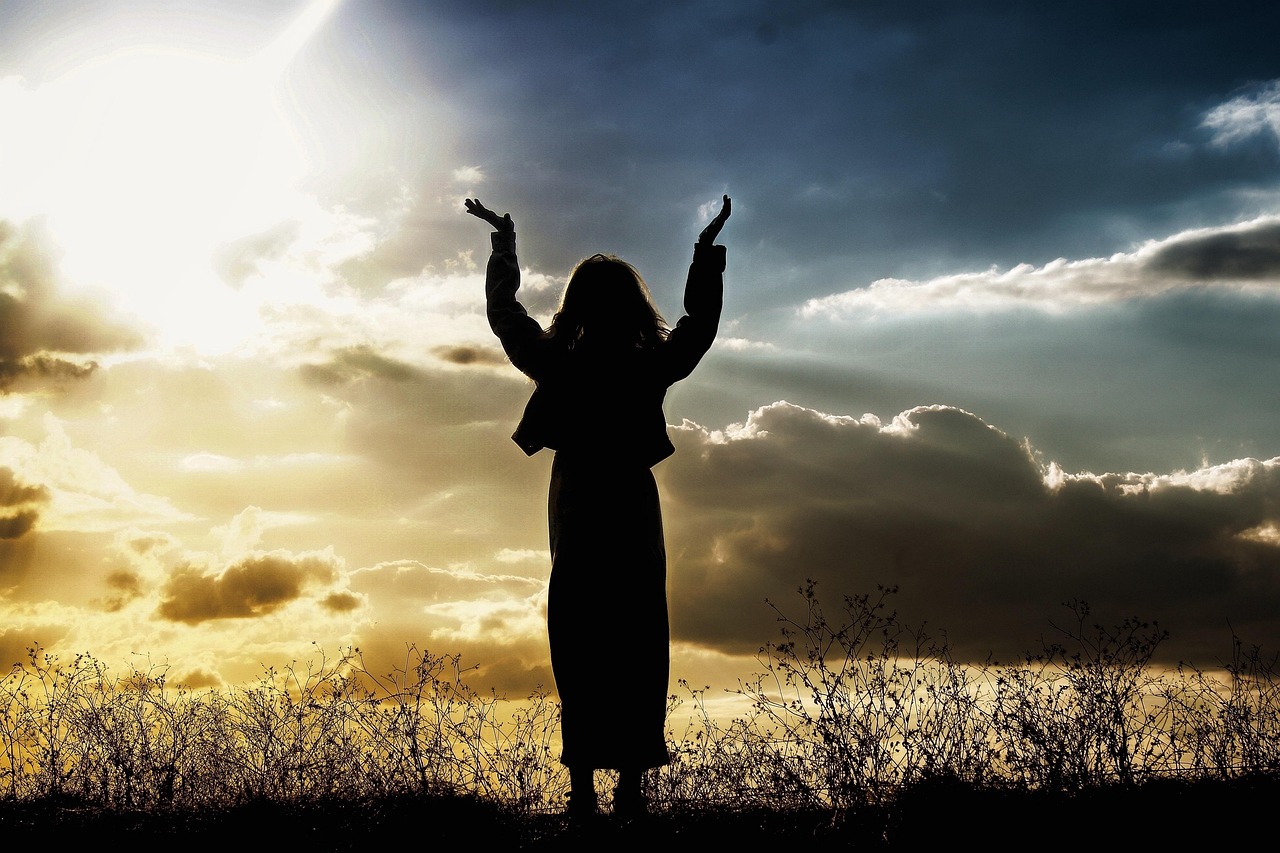 Bible open to Isaiah chapter 54 for verse-by-verse commentary and study