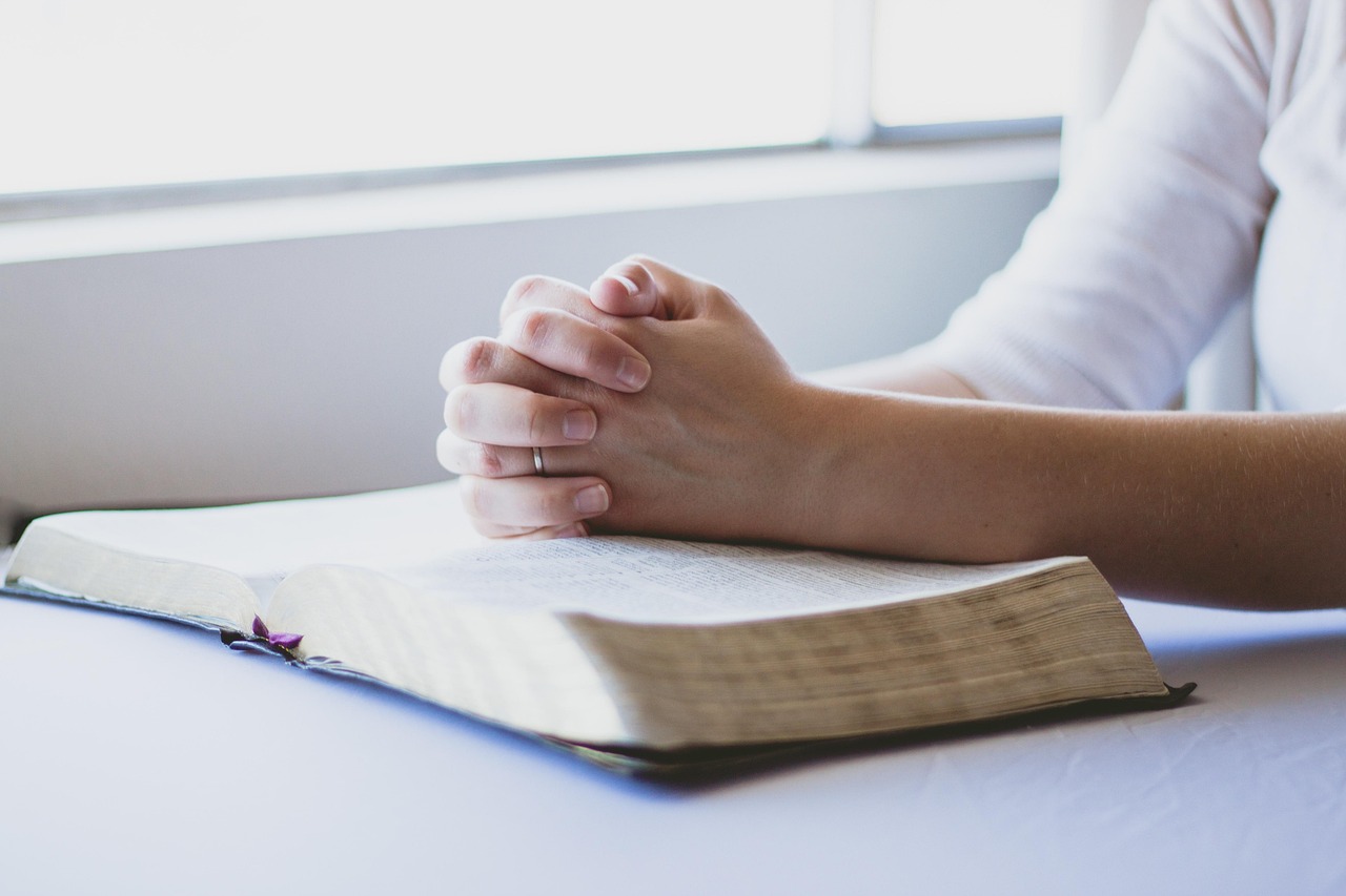 Bible open to 2 Thessalonians chapter 2 for verse-by-verse commentary and study