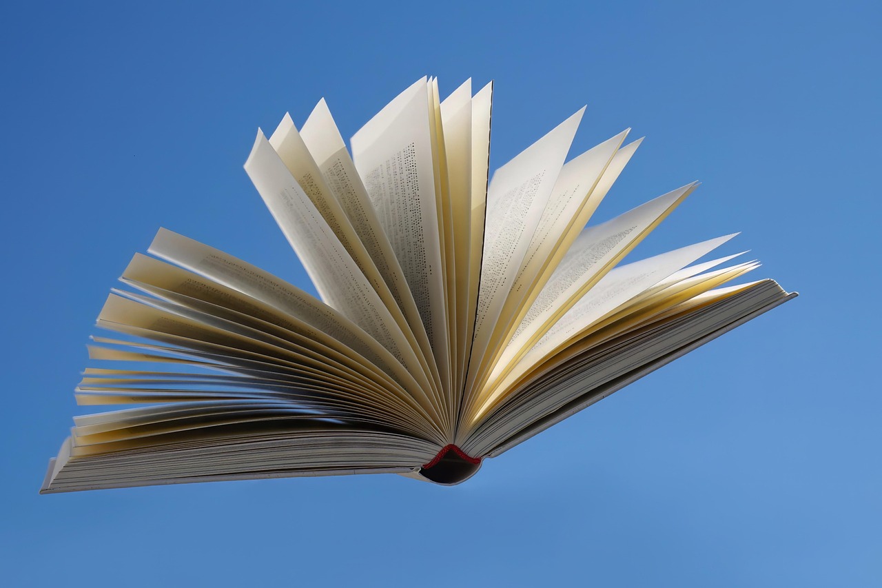 Bible open to Malachi chapter 3 for verse-by-verse commentary and study