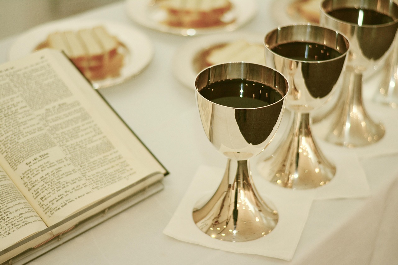 Bible open to Acts chapter 20 for verse-by-verse commentary and study