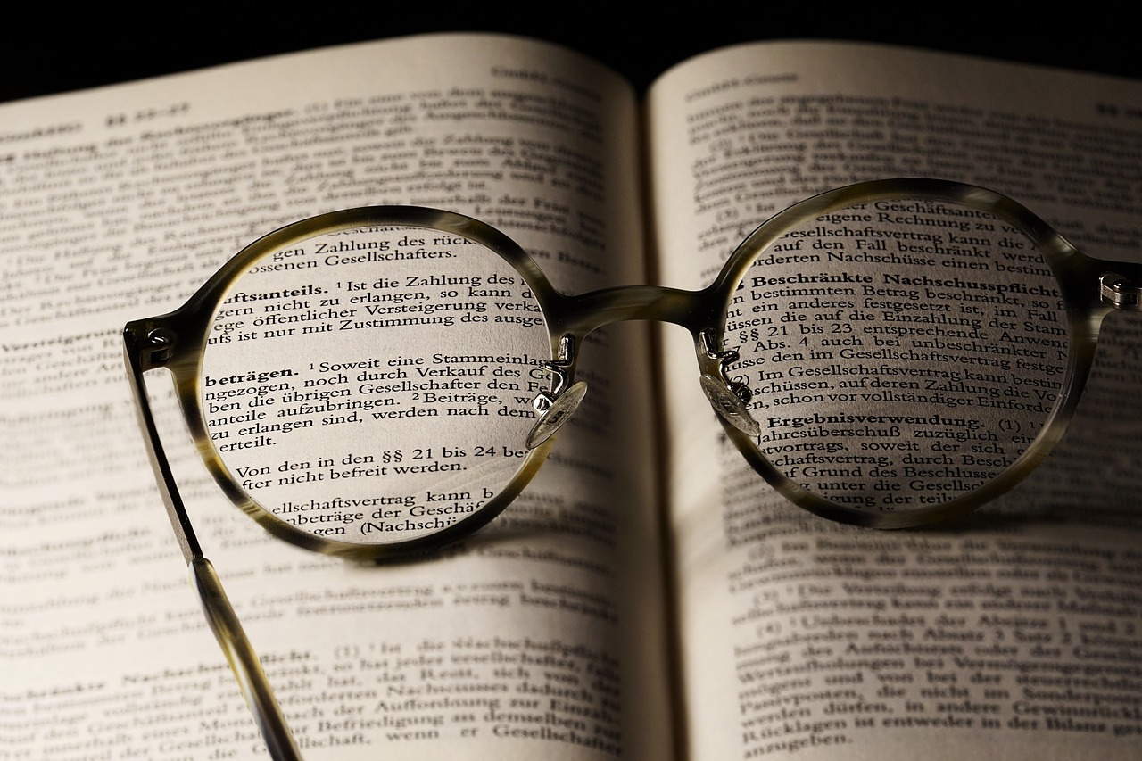 Bible open to Romans chapter 4 for verse-by-verse commentary and study