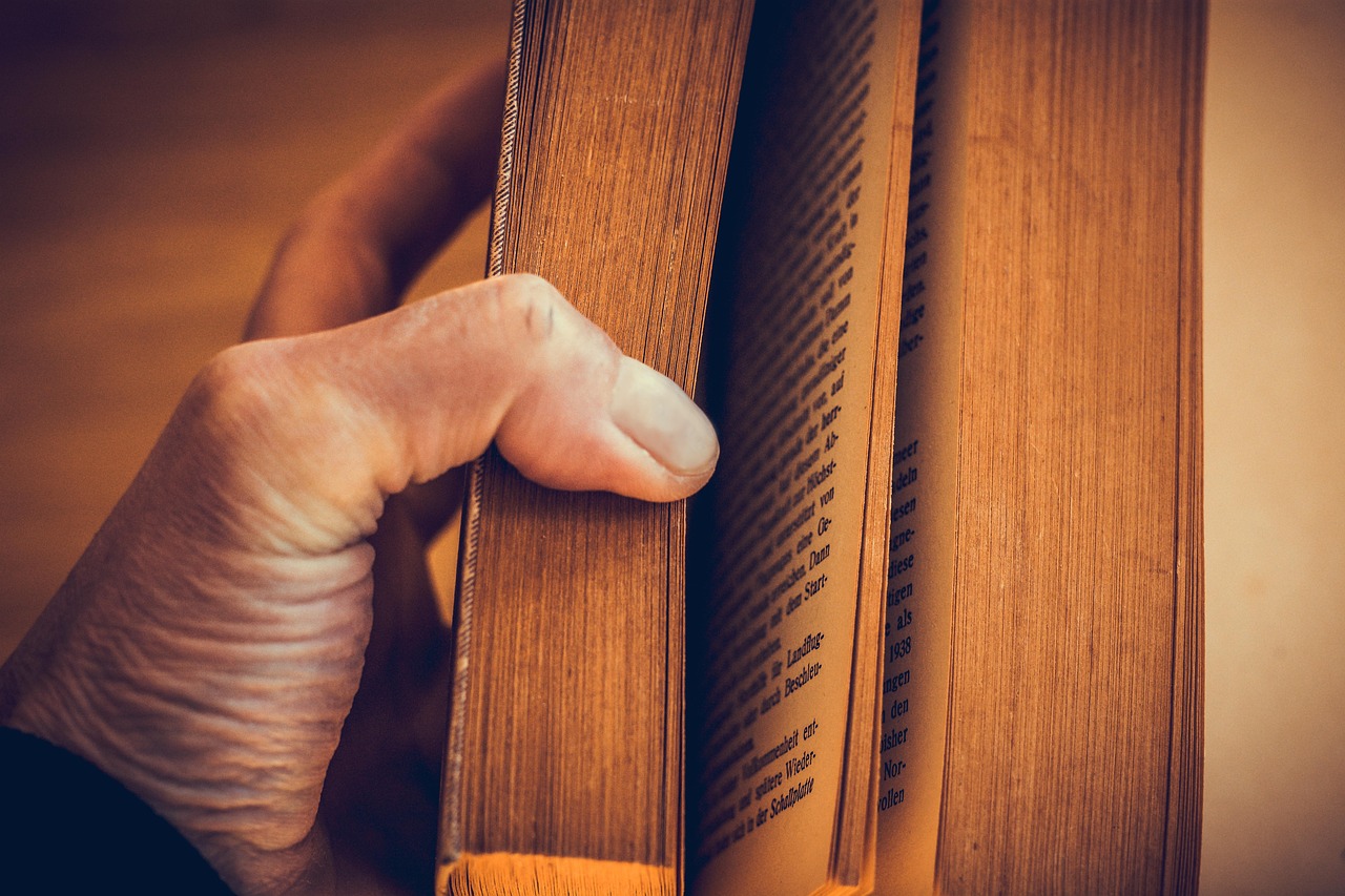 Bible open to Jonah chapter 4 for verse-by-verse commentary and study