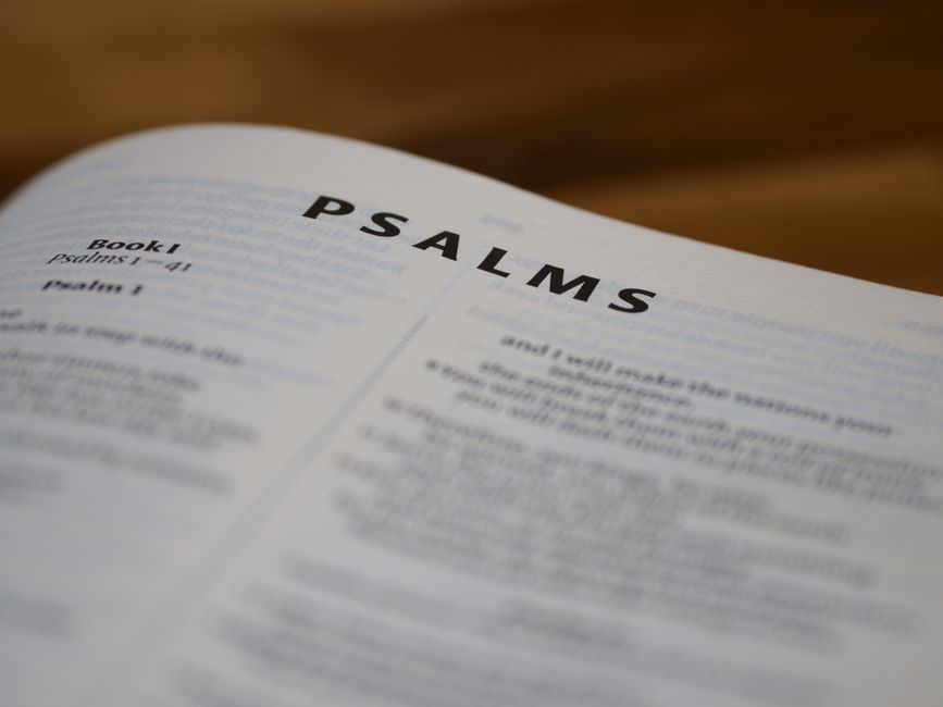 Bible open to Psalm chapter 73 for verse-by-verse commentary and study