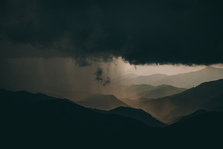 Bible open to Job chapter 38 for verse-by-verse commentary and study
