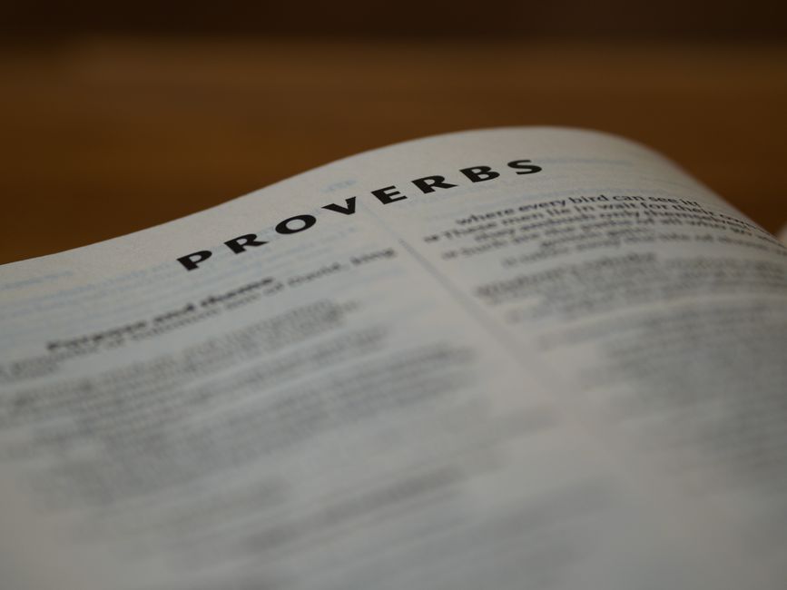 Bible open to Proverbs chapter 2 for verse-by-verse commentary and study