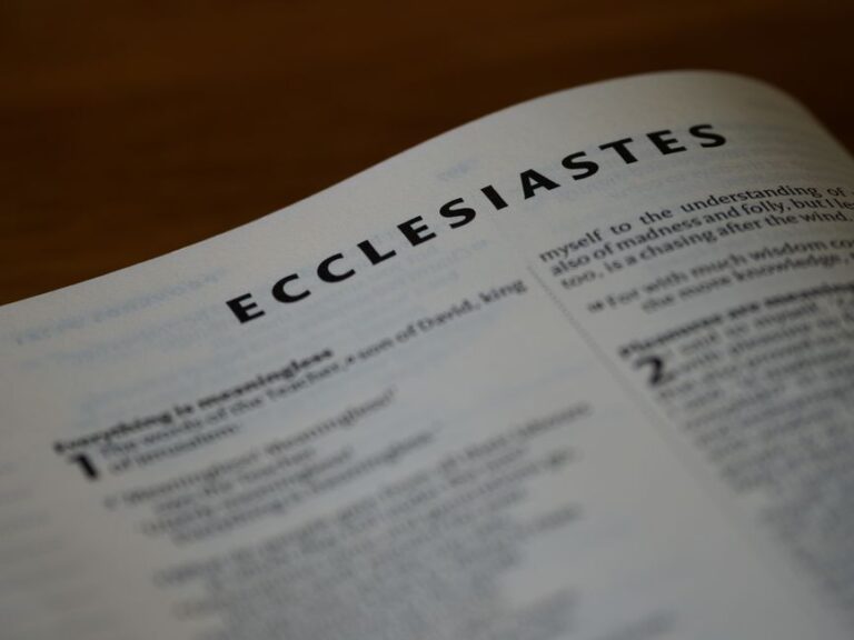 Bible open to Proverbs chapter 23 for verse-by-verse commentary and study