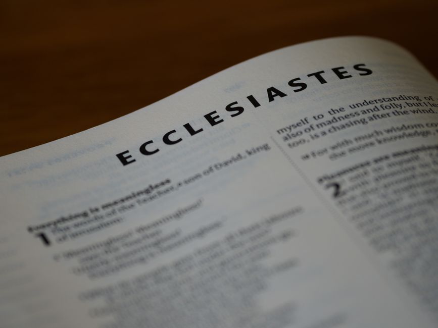 Bible open to Proverbs chapter 23 for verse-by-verse commentary and study