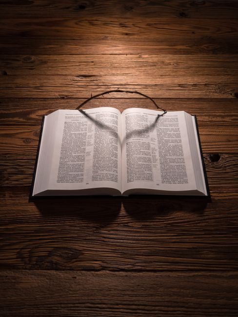 Bible open to Deuteronomy chapter 30 for verse-by-verse commentary and study