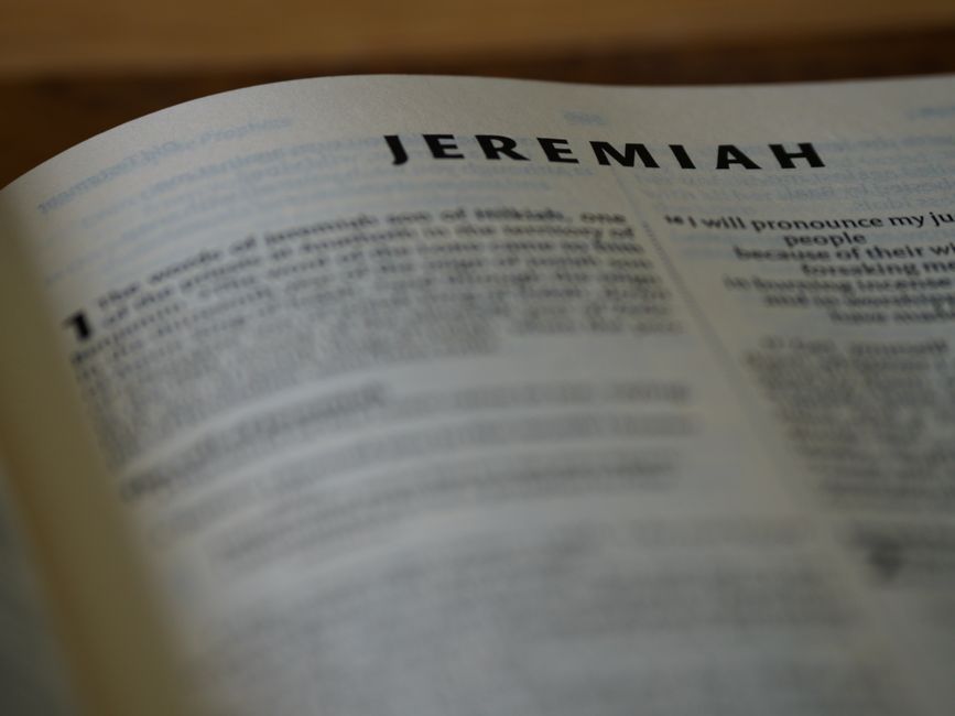 Bible open to Jeremiah chapter 18 for verse-by-verse commentary and study