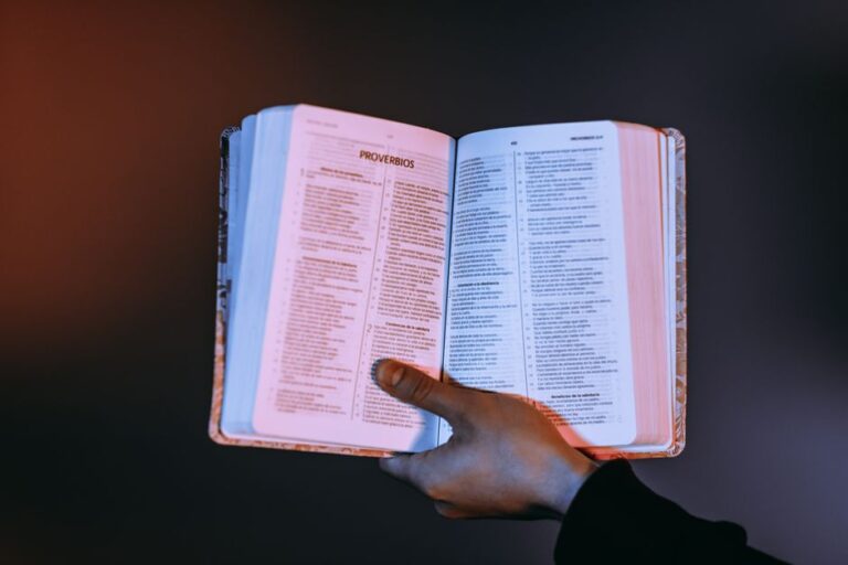 Bible open to Proverbs chapter 9 for verse-by-verse commentary and study