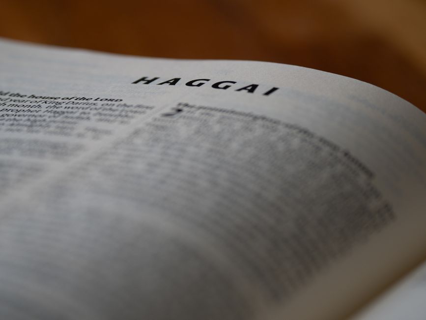 Bible open to Job chapter 42 for verse-by-verse commentary and study