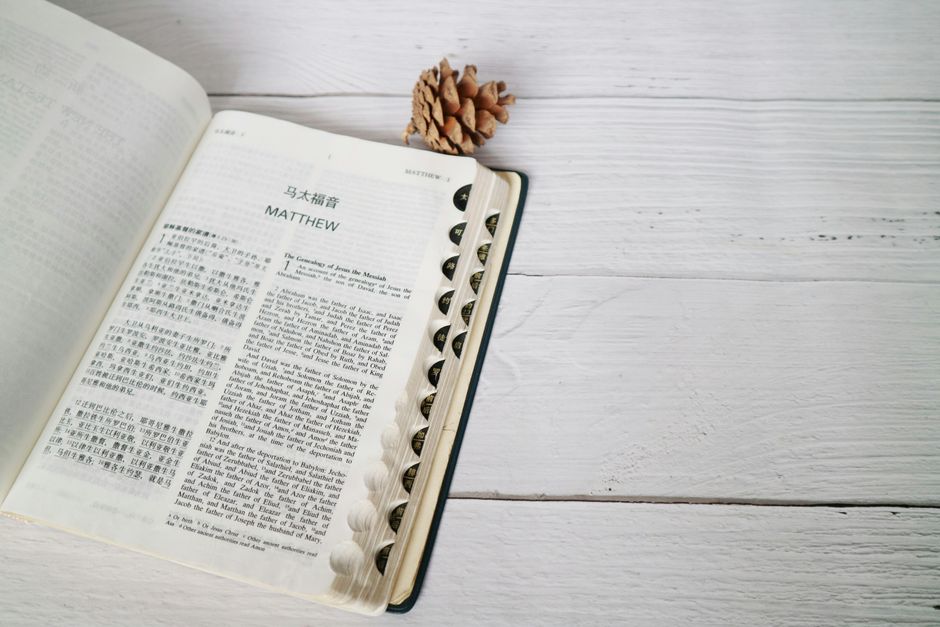 Bible open to Matthew chapter 16 for verse-by-verse commentary and study