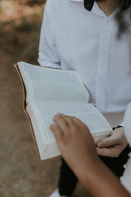 Bible open to Deuteronomy chapter 5 for verse-by-verse commentary and study