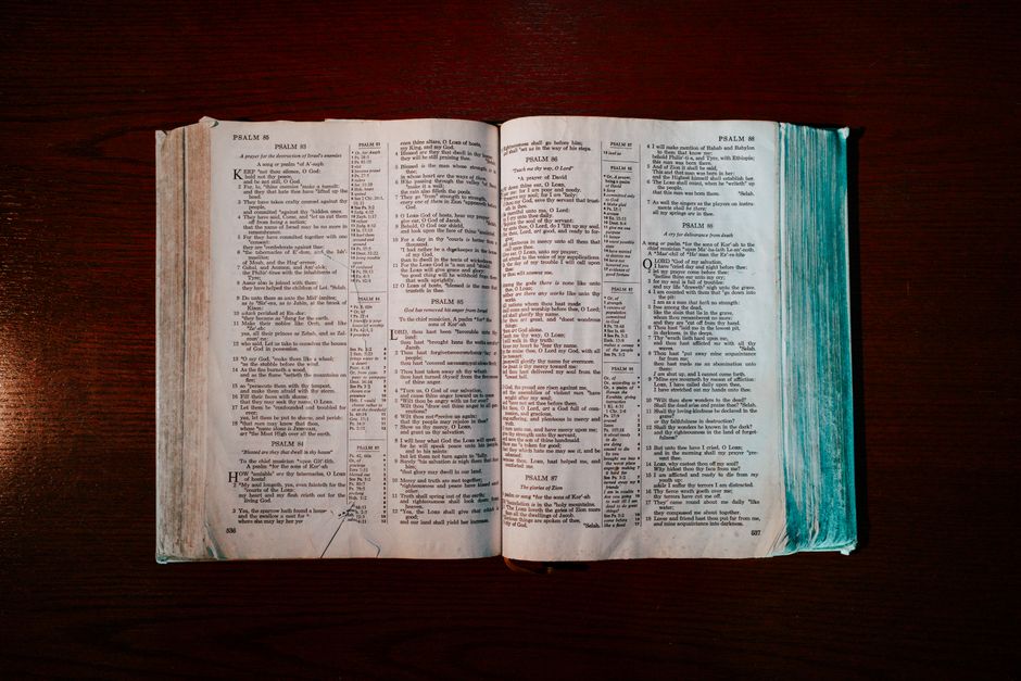 Bible open to Romans chapter 15 for verse-by-verse commentary and study