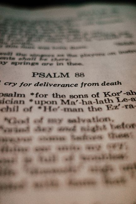 Bible open to Psalm chapter 143 for verse-by-verse commentary and study