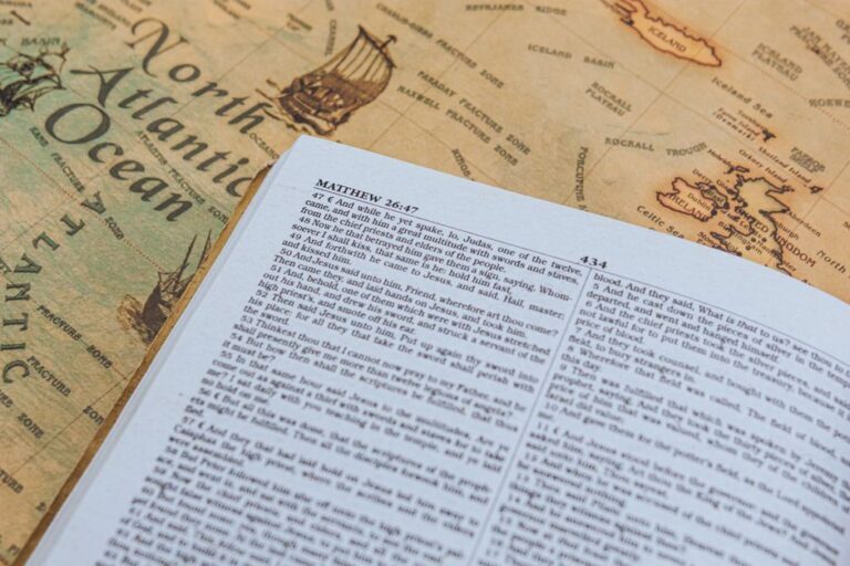 Bible open to Matthew chapter 4 for verse-by-verse commentary and study
