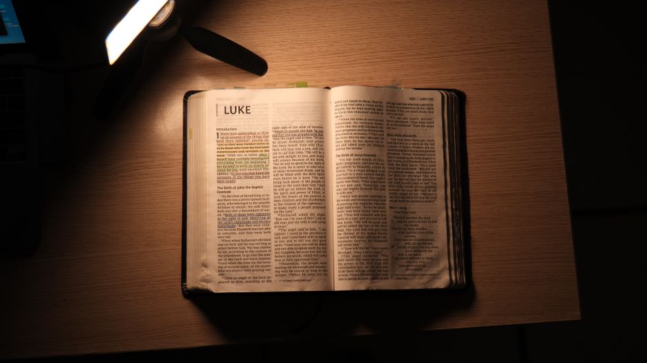 Bible open to Proverbs chapter 14 for verse-by-verse commentary and study