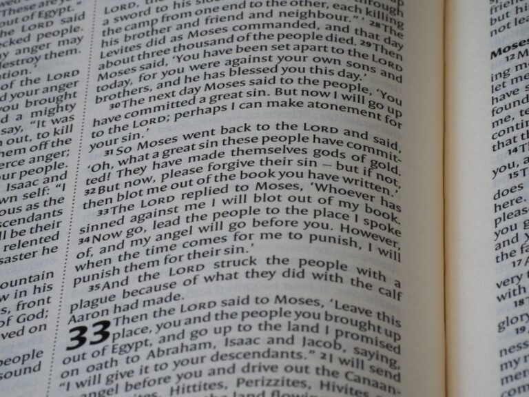 Bible open to Hebrews chapter 1 for verse-by-verse commentary and study