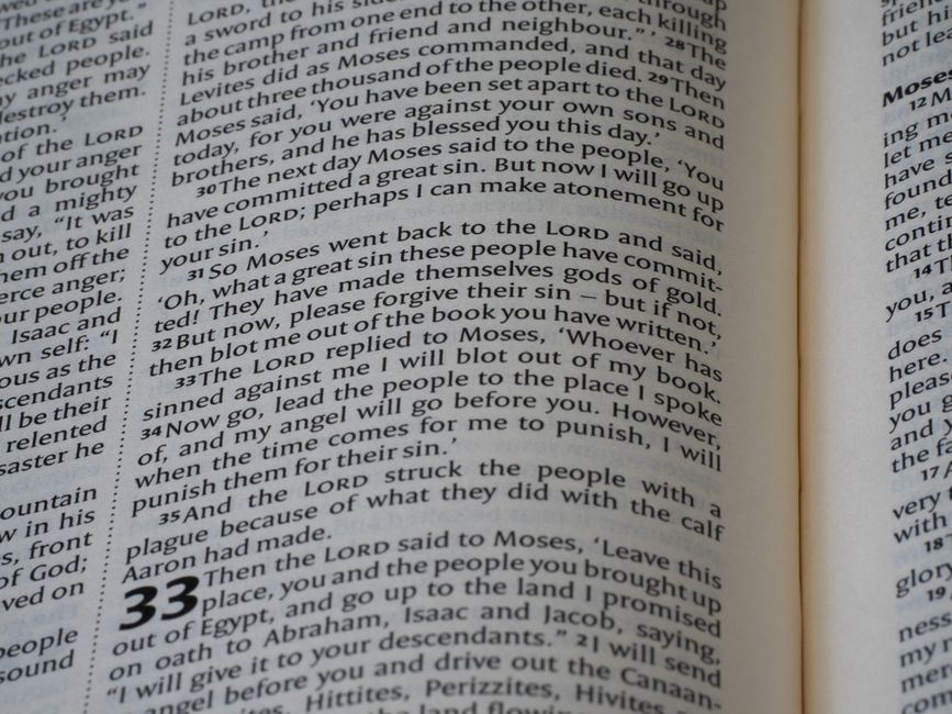 Bible open to Hebrews chapter 1 for verse-by-verse commentary and study