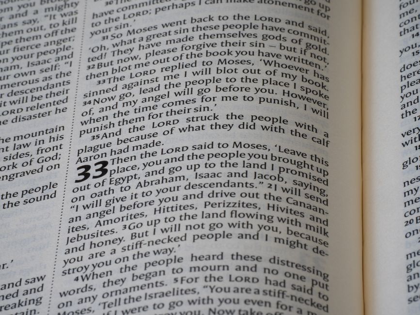 Bible open to Hebrews chapter 10 for verse-by-verse commentary and study