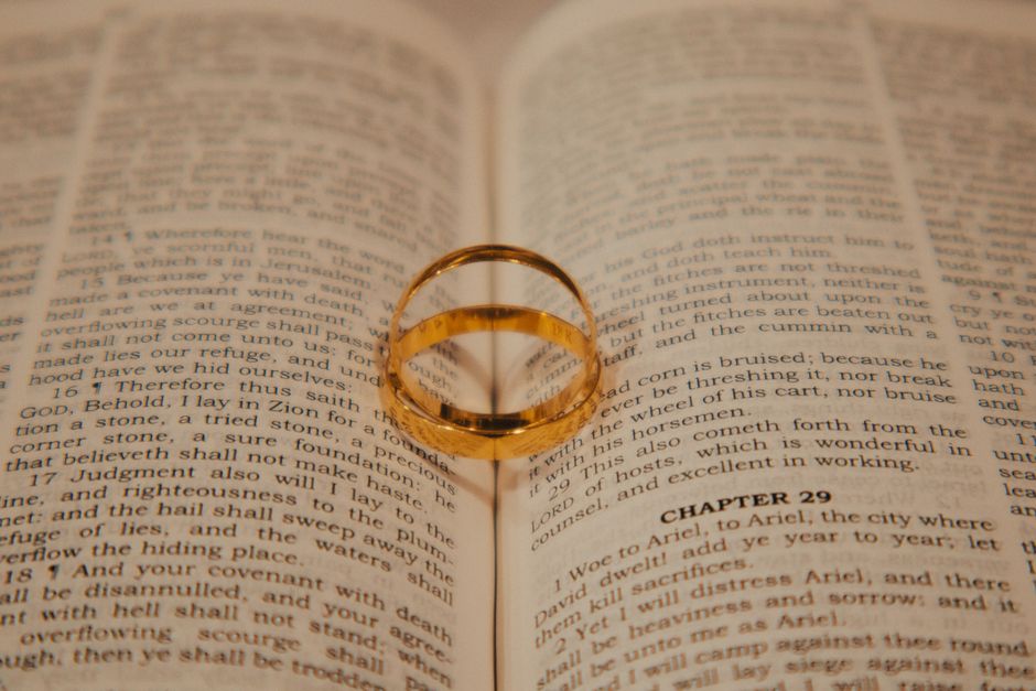 Bible open to Isaiah chapter 6 for verse-by-verse commentary and study