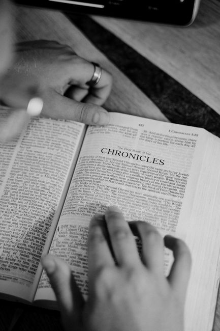 Bible open to 2 Chronicles chapter 7 for verse-by-verse commentary and study
