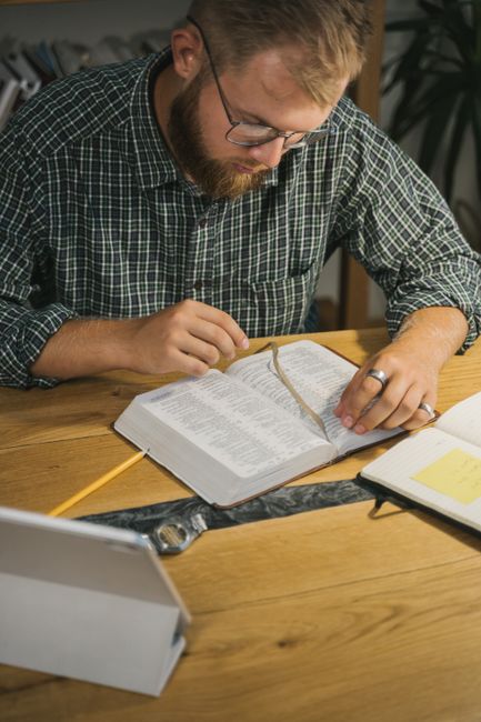 Bible open to 2 Timothy chapter 3 for verse-by-verse commentary and study