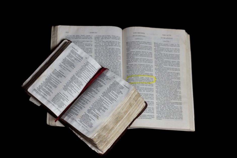 Bible open to Acts chapter 28 for verse-by-verse commentary and study