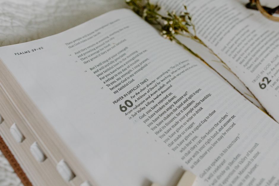 Bible open to Psalm chapter 130 for verse-by-verse commentary and study