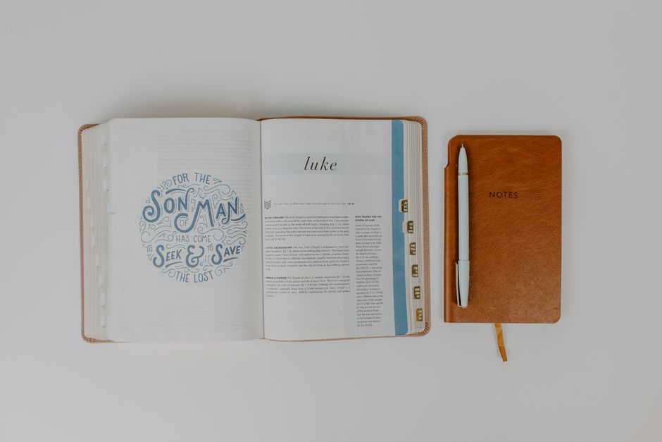 Bible open to Luke chapter 19 for verse-by-verse commentary and study