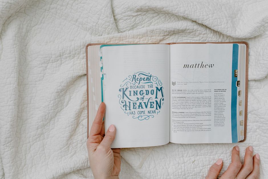 Bible open to Matthew chapter 22 for verse-by-verse commentary and study