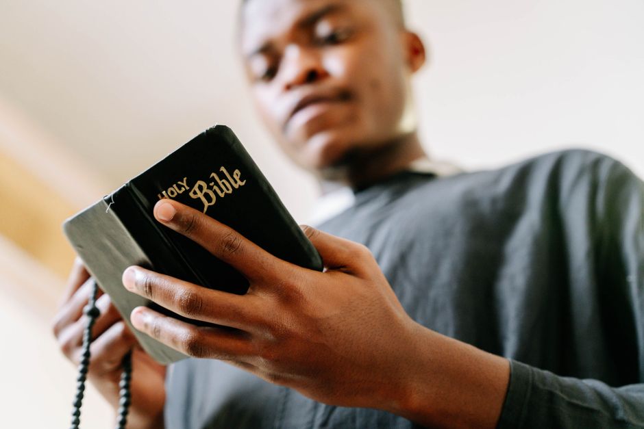 Bible open to Nehemiah chapter 4 for verse-by-verse commentary and study