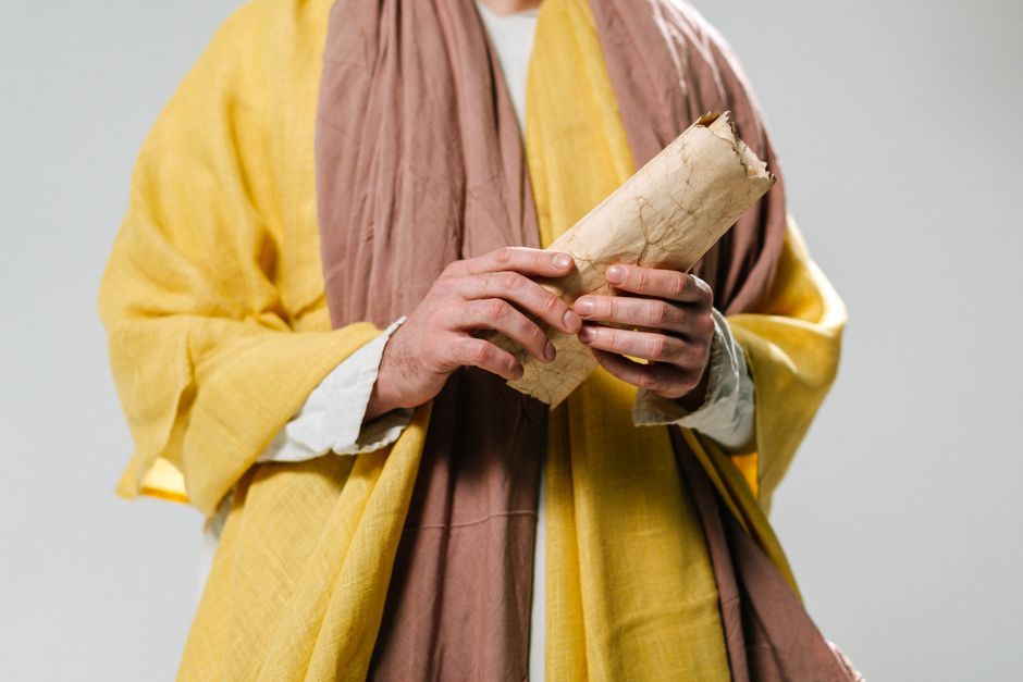 Bible open to 2 Kings chapter 2 for verse-by-verse commentary and study