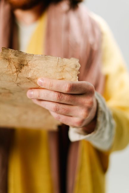 Bible open to Deuteronomy chapter 31 for verse-by-verse commentary and study