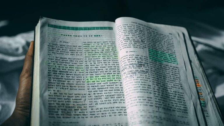Bible open to Mark chapter 10 for verse-by-verse commentary and study